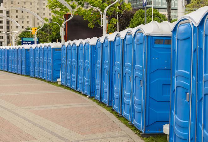 colorful portable restrooms available for rent at a local fair or carnival in Dudley